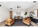 Bright home office with modern furniture, decor, and a ceiling fan at 9989 E Aleka Way # 337, Scottsdale, AZ 85262