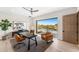 Bright home office with large sliding door leading to the pool area and a desert view at 9989 E Aleka Way # 337, Scottsdale, AZ 85262