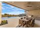 Outdoor patio with a dining area, built-in grill, and a stunning view of the pool and desert landscape at 9989 E Aleka Way # 337, Scottsdale, AZ 85262