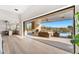 Expansive outdoor living space with a stone fireplace, seating area, and a clear view of the pool and mountains at 9989 E Aleka Way # 337, Scottsdale, AZ 85262