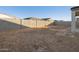 Large backyard with block wall and sandy ground at 37034 W La Paz St, Maricopa, AZ 85138