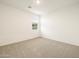 Carpeted bedroom with neutral walls and a window at 37034 W La Paz St, Maricopa, AZ 85138