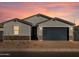 Single-story home with gray exterior, dark garage door, and stone accents at 4314 W Josephine St, San Tan Valley, AZ 85144