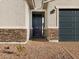 Modern dark-stained front door with stone accents at 4314 W Josephine St, San Tan Valley, AZ 85144