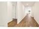 Bright hallway with wood-look tile flooring at 4314 W Josephine St, San Tan Valley, AZ 85144