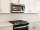 Overhead view of a kitchen with stainless steel microwave and range at 4314 W Josephine St, San Tan Valley, AZ 85144