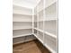 Large walk-in pantry with ample shelving for storage at 4314 W Josephine St, San Tan Valley, AZ 85144