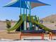 Modern playground with slides, climbing structures, shade cover, and benches at 4314 W Josephine St, San Tan Valley, AZ 85144