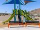 Modern playground with slides, climbing structures, shade cover, and benches at 4314 W Josephine St, San Tan Valley, AZ 85144