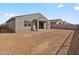 Exterior of a new home with minimal landscaping in backyard at 4937 W Hunter Trl, San Tan Valley, AZ 85144