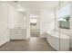 Bright bathroom featuring large mirror, tub and tile flooring, and natural light at 4937 W Hunter Trl, San Tan Valley, AZ 85144