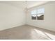 Dining room with large window and chandelier at 4937 W Hunter Trl, San Tan Valley, AZ 85144