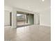 Bright living room features modern tile floors, recessed lighting, and backyard view at 4937 W Hunter Trl, San Tan Valley, AZ 85144