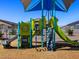 Community playground featuring play structures with slides, climbing areas, and safe surfacing for to enjoy at 4937 W Hunter Trl, San Tan Valley, AZ 85144