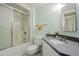 Bright bathroom with tub and shower combination and sleek, modern countertop at 12442 W Marble Dr, Sun City West, AZ 85375