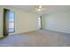 Bright bedroom with carpet floor, ceiling fan and two windows with views at 12442 W Marble Dr, Sun City West, AZ 85375