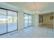 Bright dining area with sliding glass doors to outdoor patio at 12442 W Marble Dr, Sun City West, AZ 85375