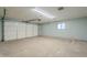 Spacious two-car garage features an automatic door and a well-lit interior at 12442 W Marble Dr, Sun City West, AZ 85375