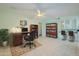 An organized home office complete with built-in shelving and two work areas provides an ideal space for productivity at 12442 W Marble Dr, Sun City West, AZ 85375