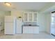 Kitchen area featuring white cabinets, counter space, and modern appliances at 12442 W Marble Dr, Sun City West, AZ 85375