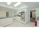 Sunlit kitchen features stainless steel appliances and tile flooring at 12442 W Marble Dr, Sun City West, AZ 85375