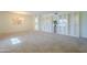 Spacious living room with elegant built-ins, soft carpet, and natural light at 12442 W Marble Dr, Sun City West, AZ 85375