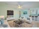 Stylish living room with a wet bar, comfortable seating, and modern decor creates a perfect space for relaxing at 12442 W Marble Dr, Sun City West, AZ 85375