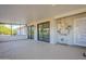 Enclosed patio with ample space and views of the well-maintained backyard at 12442 W Marble Dr, Sun City West, AZ 85375