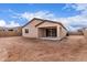 View of a backyard featuring a covered patio, block fence and dirt landscaping at 18650 E Panchito Dr, Gold Canyon, AZ 85118