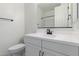 Bathroom with a single sink vanity, white toilet and light walls at 18650 E Panchito Dr, Gold Canyon, AZ 85118