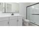 Modern bathroom featuring a white vanity, black hardware, and walk-in shower with glass door at 18650 E Panchito Dr, Gold Canyon, AZ 85118