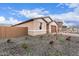 Single-story home featuring low-maintenance gravel landscaping and an attached two-car garage at 18650 E Panchito Dr, Gold Canyon, AZ 85118