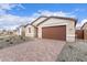 Beautiful single-story home showcasing a paver driveway and manicured gravel landscaping at 18650 E Panchito Dr, Gold Canyon, AZ 85118