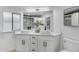 Modern bathroom with dual vessel sinks, a large mirror, and a luxurious shower stall at 2233 E Behrend Dr # 132, Phoenix, AZ 85024