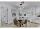 Modern dining area features a glass-top table, stylish chairs, and contemporary lighting fixture at 2233 E Behrend Dr # 132, Phoenix, AZ 85024