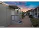 Mobile home exterior with a covered porch, white door, and desert landscaping in a gravel yard at 2233 E Behrend Dr # 132, Phoenix, AZ 85024