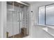 Luxurious shower stall with multiple shower heads, wooden benches, and glass enclosure at 2233 E Behrend Dr # 132, Phoenix, AZ 85024