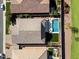 Aerial view of a home with a pool and artificial turf at 1132 W Pagoda Ave, Queen Creek, AZ 85140