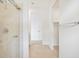 Bathroom featuring tiled shower, wood flooring, and walk-in closet at 16017 W Cottontail Ln, Surprise, AZ 85387