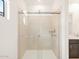 Modern bathroom featuring glass shower doors and tiled shower at 16017 W Cottontail Ln, Surprise, AZ 85387