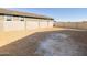 Expansive backyard space enclosed by a sturdy block wall, offering privacy and potential for landscaping at 16082 W Desert Spoon Dr, Surprise, AZ 85387