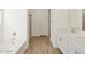 Bathroom featuring double sinks, a shower, and a soaking tub at 16082 W Desert Spoon Dr, Surprise, AZ 85387