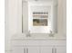 Bathroom featuring double sinks with a large mirror at 16082 W Desert Spoon Dr, Surprise, AZ 85387