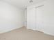 Bedroom features include neutral carpeting and a closet with sliding doors at 16082 W Desert Spoon Dr, Surprise, AZ 85387