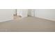 Spacious carpeted bedroom with white walls at 16082 W Desert Spoon Dr, Surprise, AZ 85387