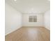A bright living room with recessed lighting and tile-wood flooring at 16082 W Desert Spoon Dr, Surprise, AZ 85387