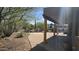 Inviting covered patio overlooking the pool area and native landscaping, perfect for outdoor living at 2926 W Tanya Trl, Phoenix, AZ 85086