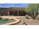 Lush desert landscaping surrounds a backyard pool with covered patio and seating at 2926 W Tanya Trl, Phoenix, AZ 85086