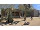Inviting desert home featuring native landscaping and a charming front porch entrance with a welcoming wreath at 2926 W Tanya Trl, Phoenix, AZ 85086
