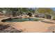 Desert backyard featuring a beautiful pool with waterfall feature and relaxing patio area at 2926 W Tanya Trl, Phoenix, AZ 85086